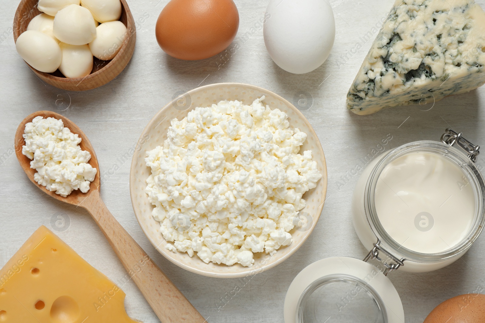 Photo of Different dairy products on white table, flat lay