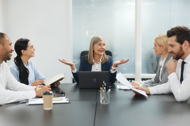 Lawyers working together at table in office