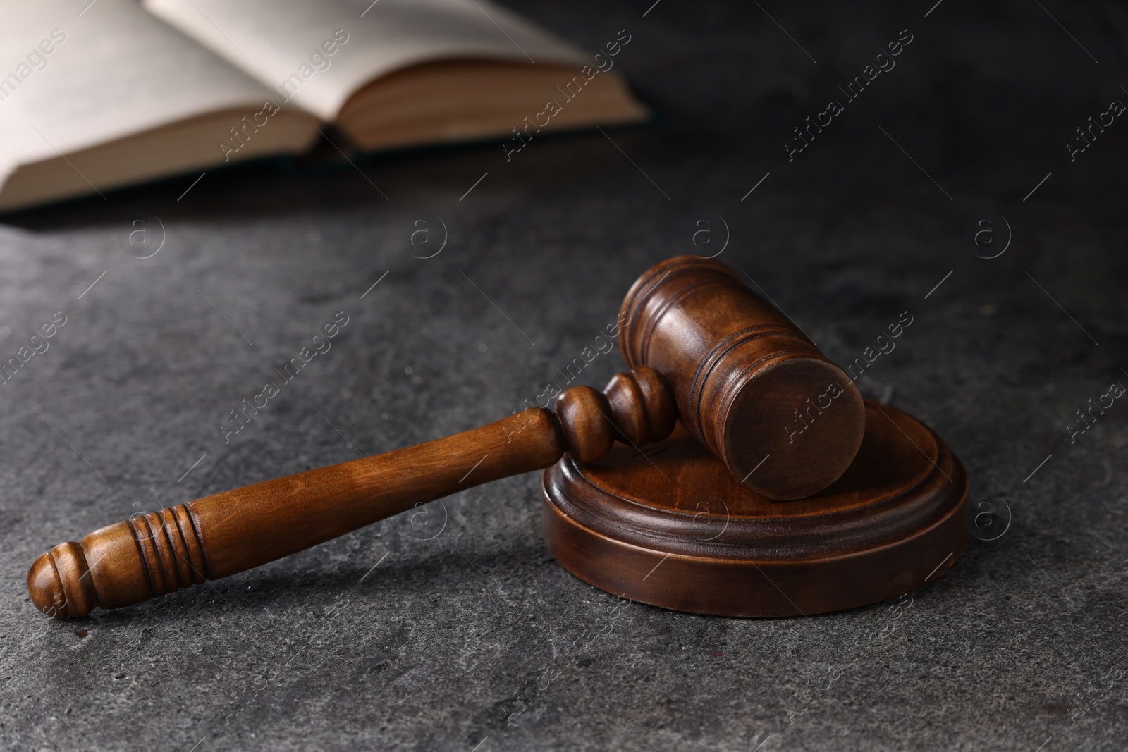 Photo of Law concept. Judge's gavel on grey textured table