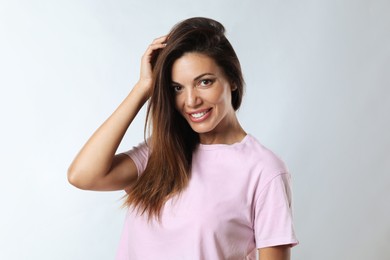 Portrait of beautiful woman on white background