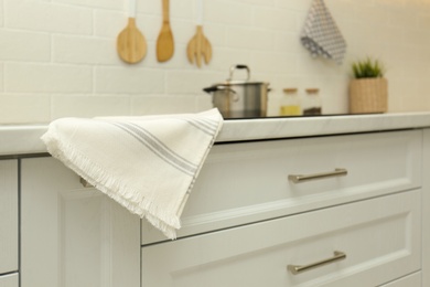 Photo of Cotton towel on countertop in modern kitchen