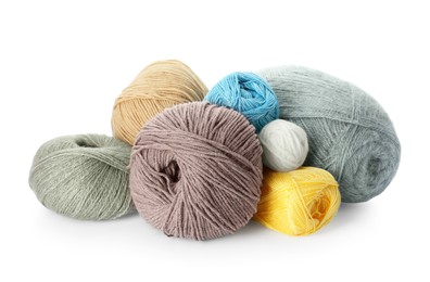 Different balls of woolen knitting yarns on white background