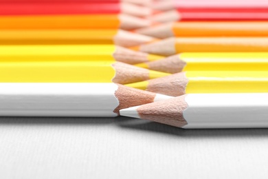 Photo of Set of colorful pencils on light background, closeup