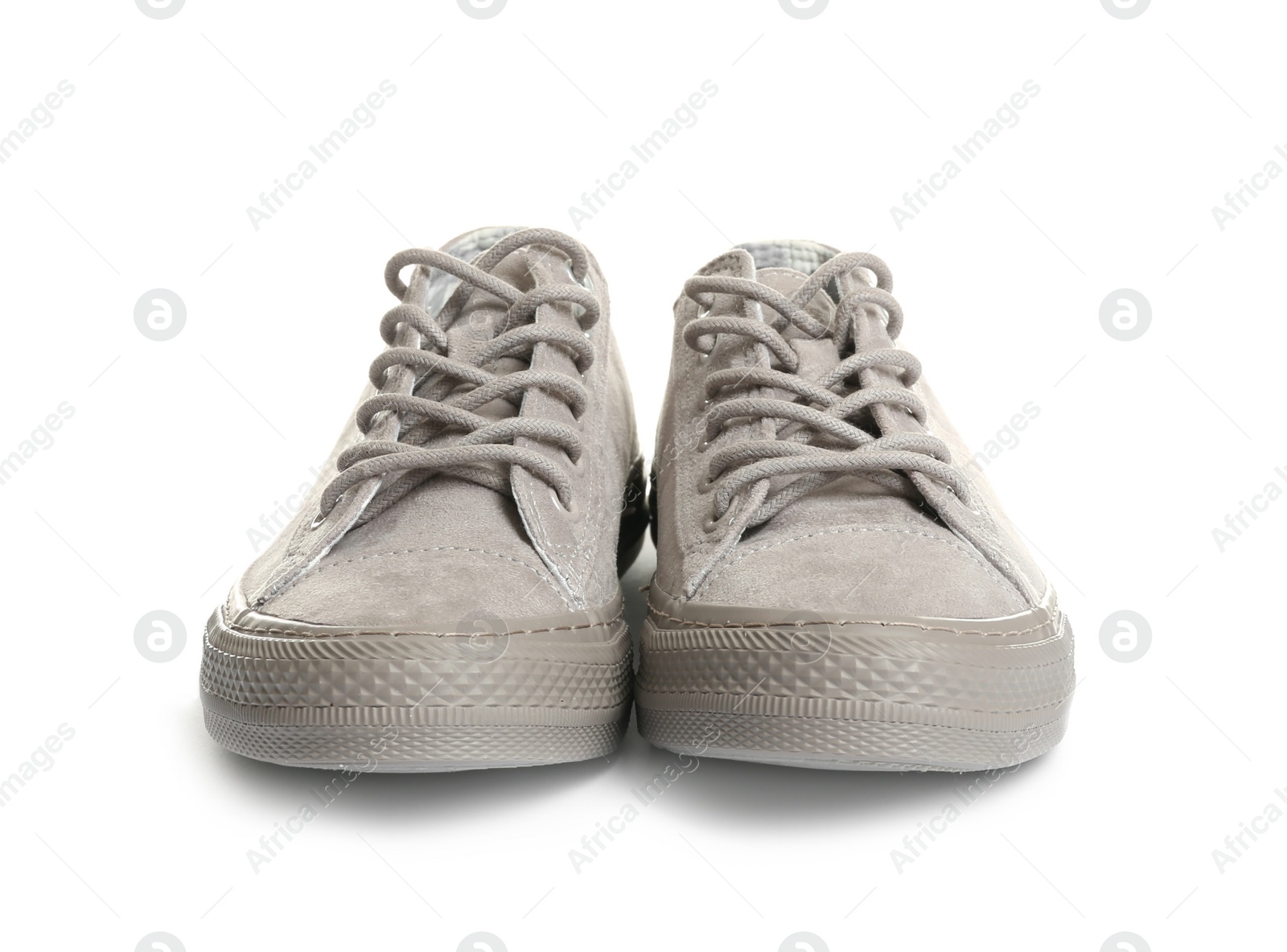 Photo of Pair of stylish sneakers on white background