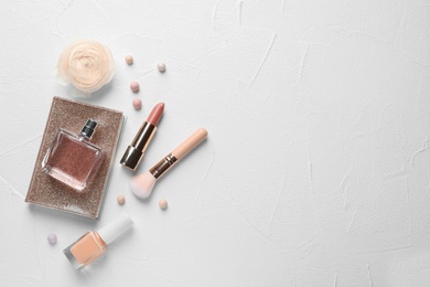 Flat lay composition with decorative cosmetics on light background