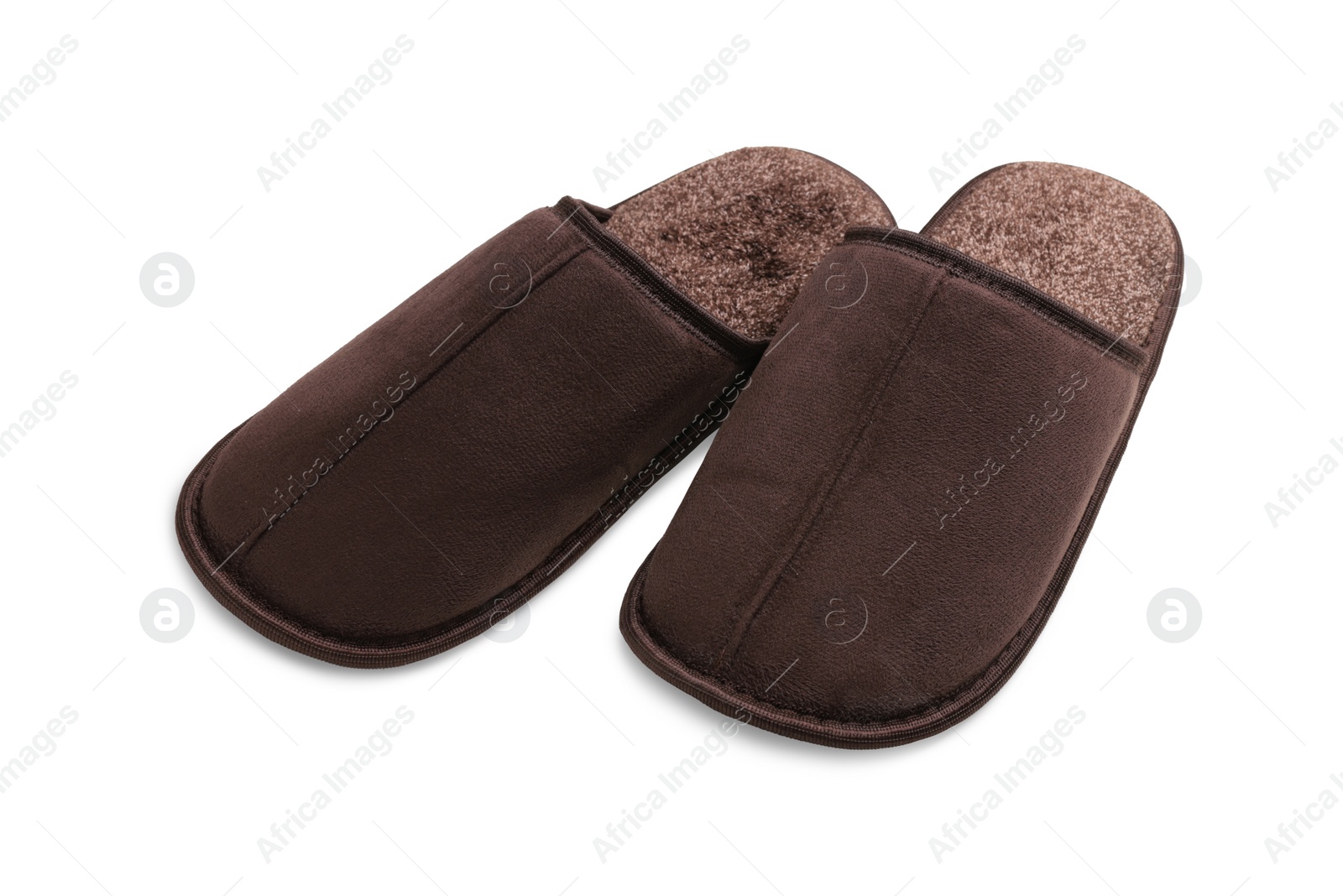 Photo of Pair of brown slippers on white background