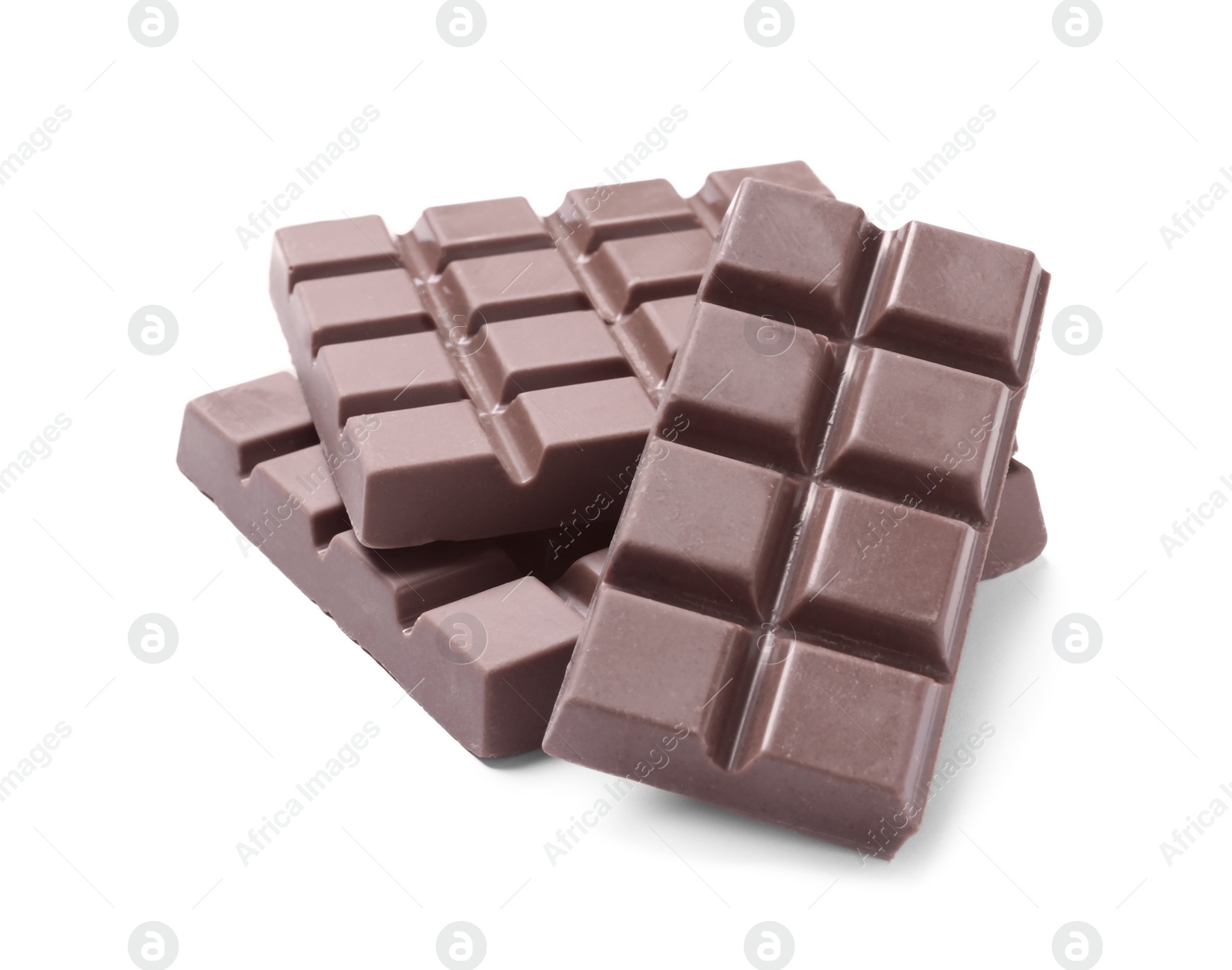 Photo of Delicious milk chocolate bars isolated on white