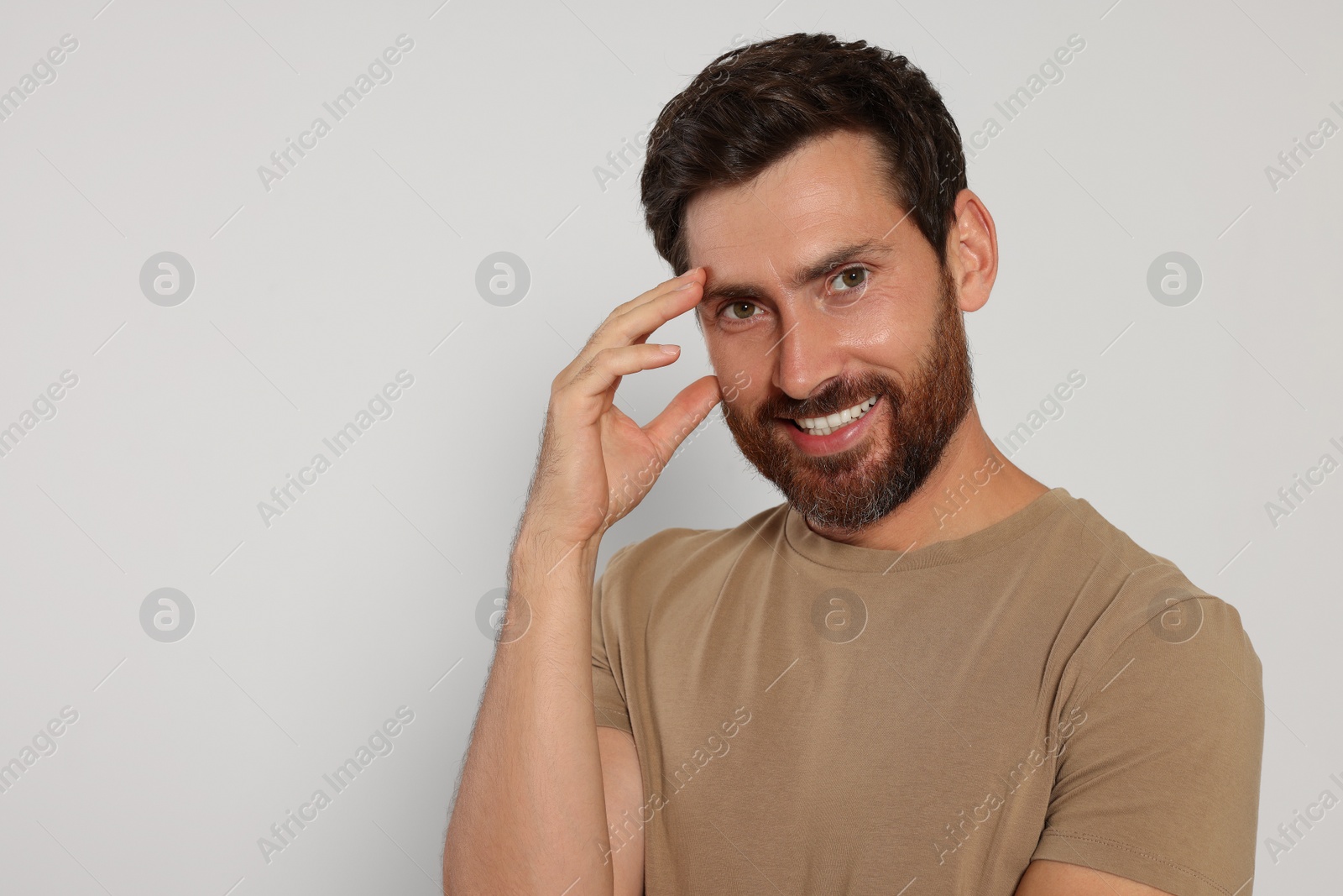 Photo of Portrait of handsome bearded man on white background