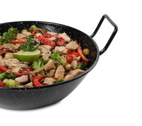 Photo of Stir-fry. Tasty noodles with meat and vegetables in wok isolated on white