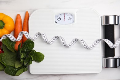 Photo of Flat lay composition with scales and vegetables on white marble table,