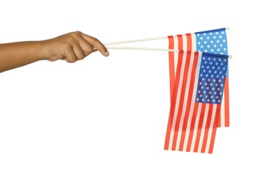 African-American child holding national flags on white background, closeup