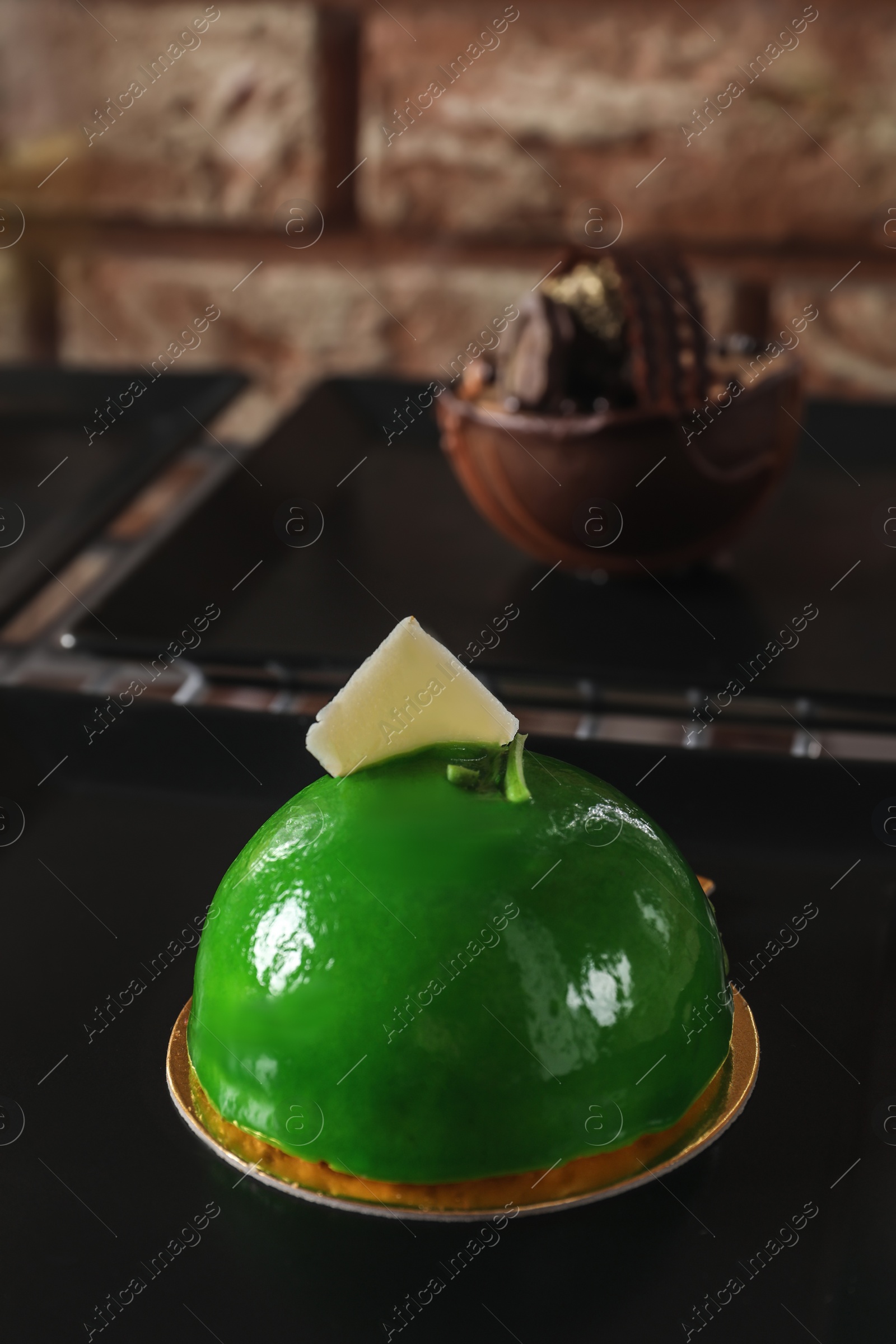 Photo of Delicious apple dessert decorated with white chocolate on plate, space for text