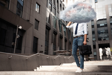 Image of Man with cloud on his head outdoors. Modern storage technology concept