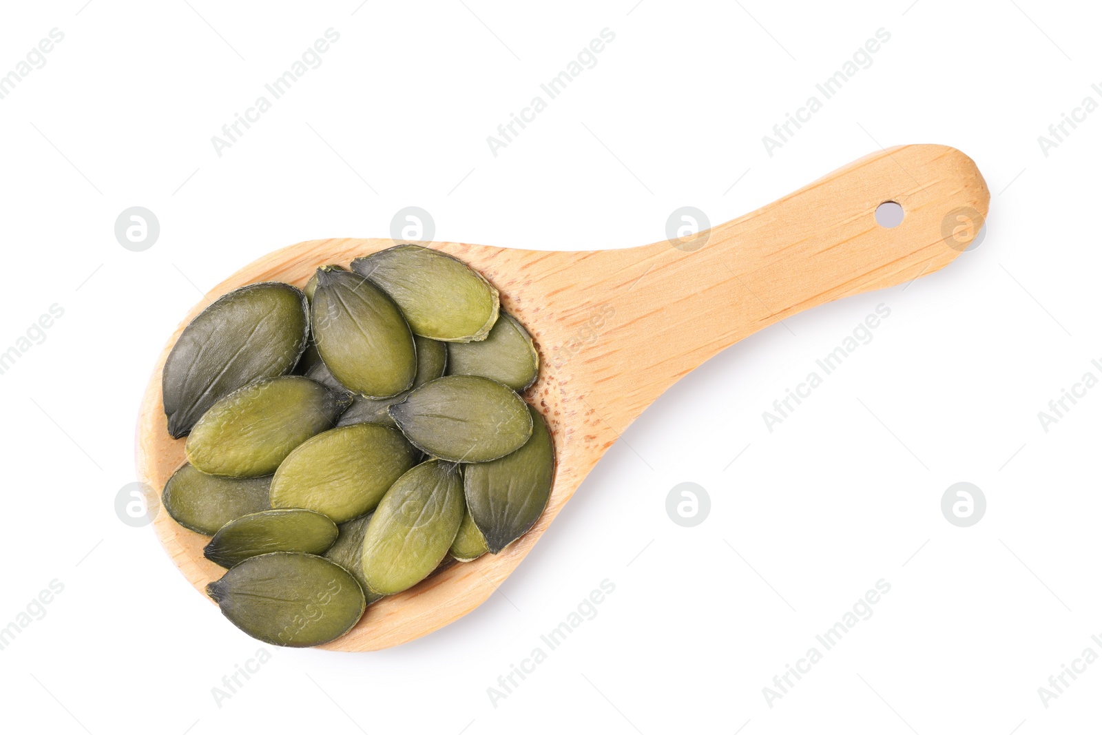 Photo of Wooden spoon with pumpkin seeds isolated on white, top view