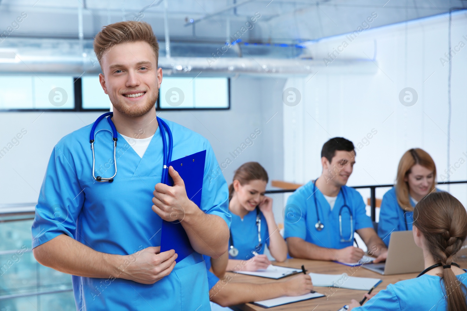 Photo of Medical student with groupmates in university library