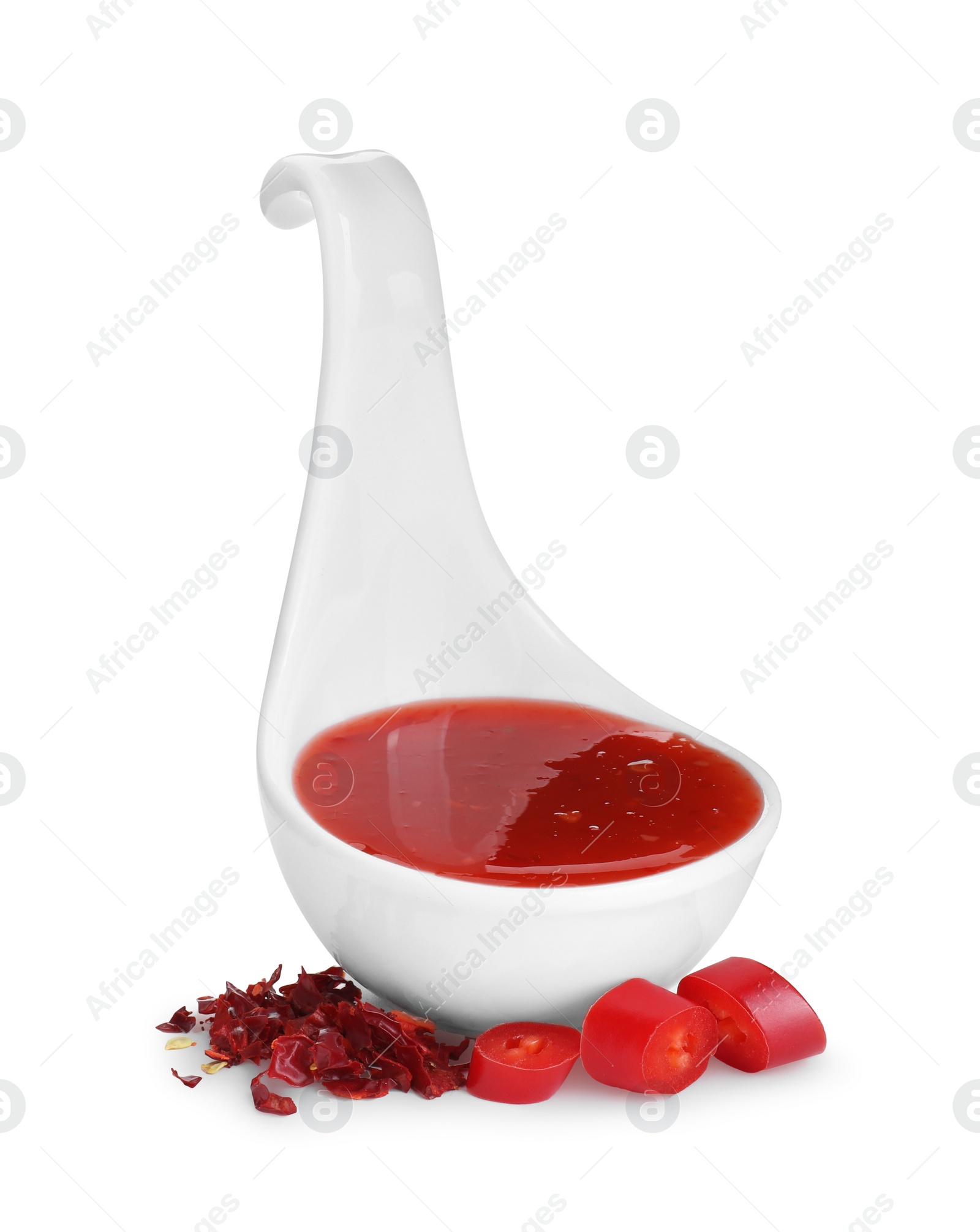 Photo of Chili sauce in spoon isolated on white