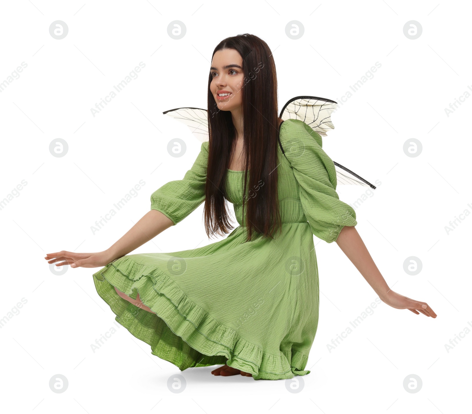 Photo of Beautiful girl in fairy costume with wings on white background