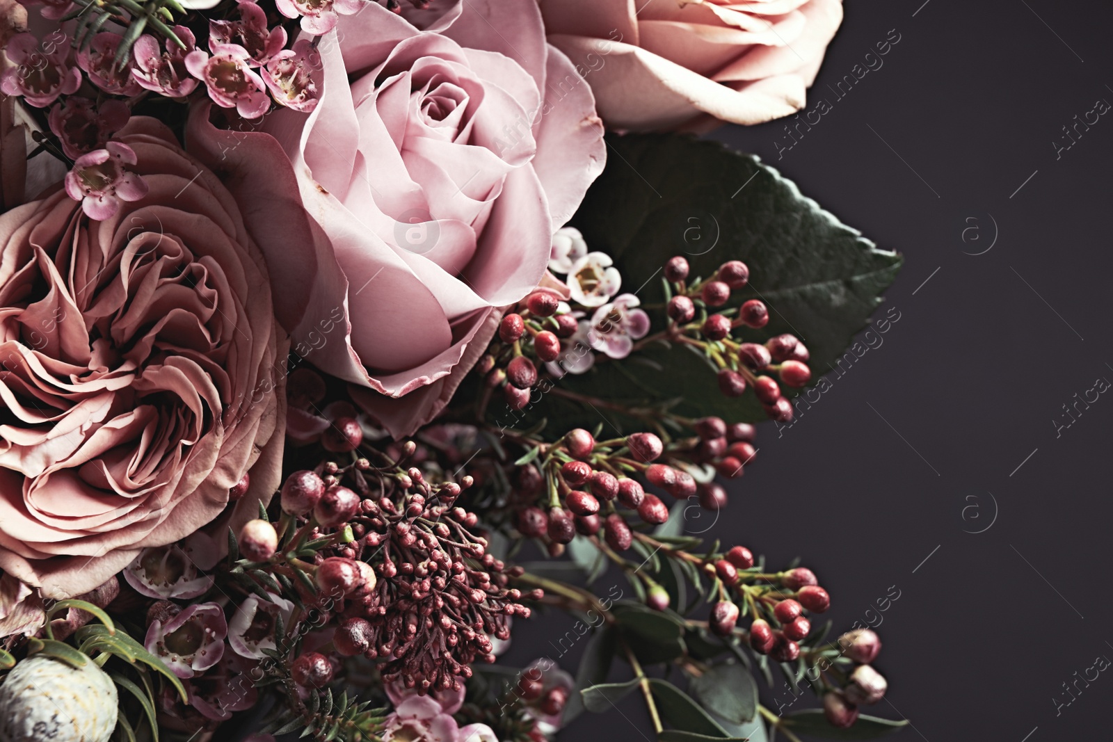 Photo of Beautiful bouquet on black background, closeup. Floral card design with dark vintage effect