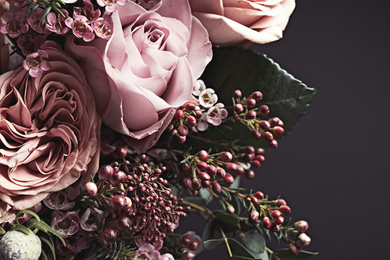 Photo of Beautiful bouquet on black background, closeup. Floral card design with dark vintage effect