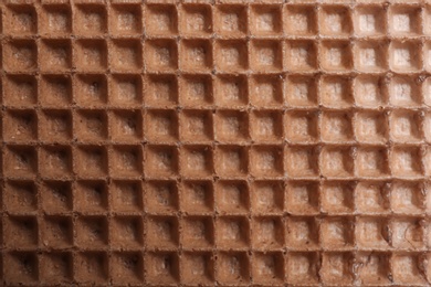 Photo of Tasty wafer as background, closeup. Crispy food