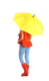 Woman with yellow umbrella on white background