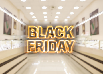 Image of Blurred view of modern shopping mall interior. Black Friday Sale