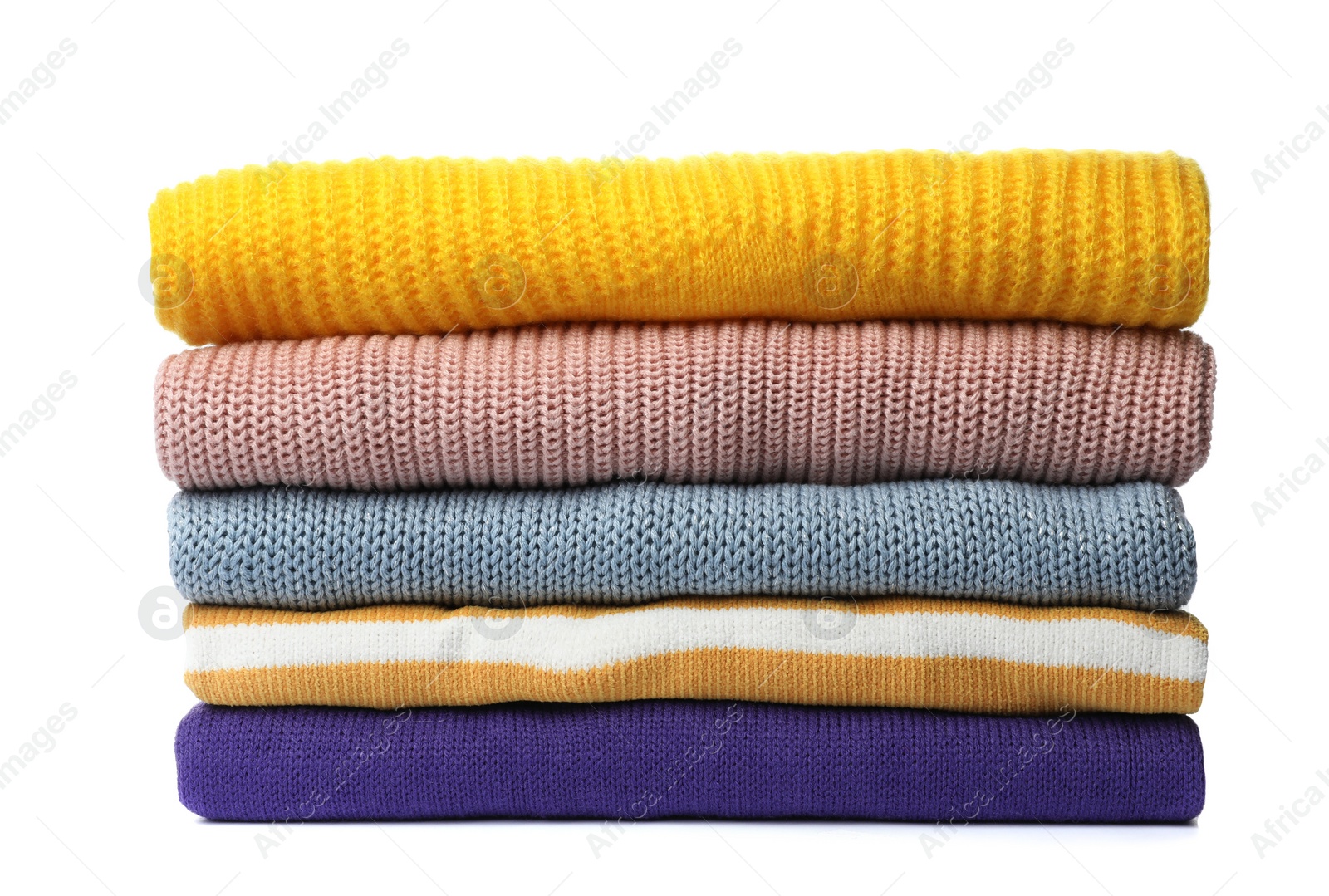 Photo of Stack of folded knitted sweaters on white background