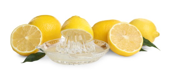 Glass squeezer and fresh lemons on white background