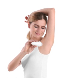 Photo of Young woman using deodorant on white background