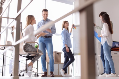 Photo of Young people having business training in office