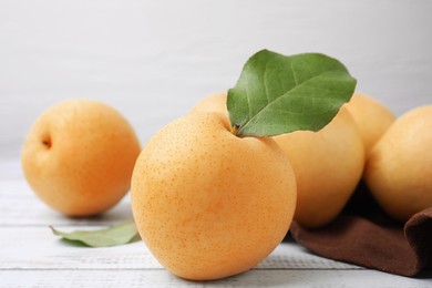 Delicious apple pears on white wooden table