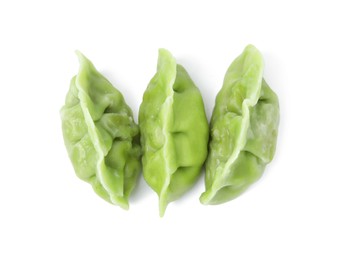 Photo of Delicious green dumplings (gyozas) isolated on white, top view