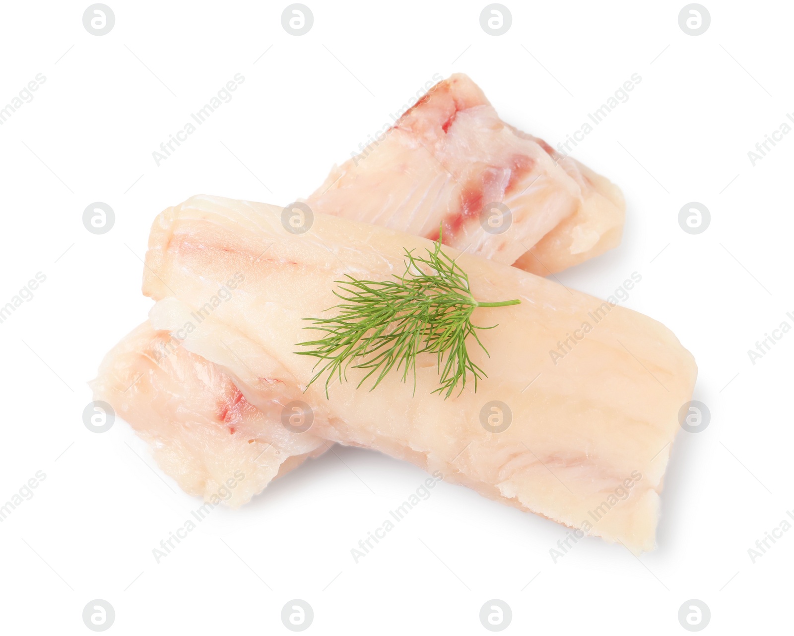 Photo of Pieces of raw cod fish and dill isolated on white