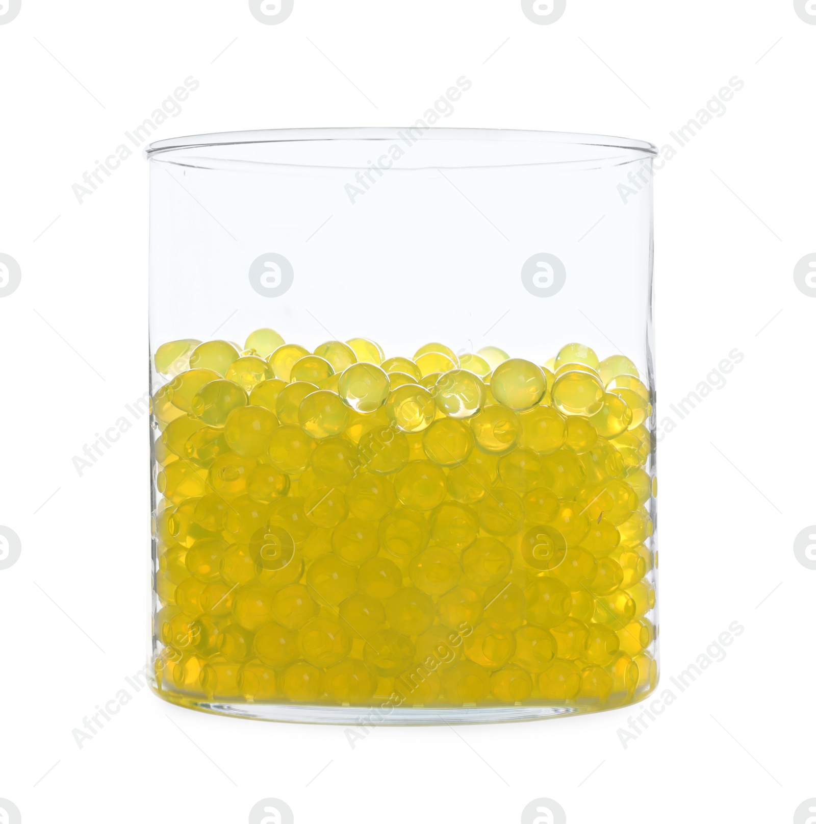 Photo of Yellow filler in glass vase isolated on white. Water beads