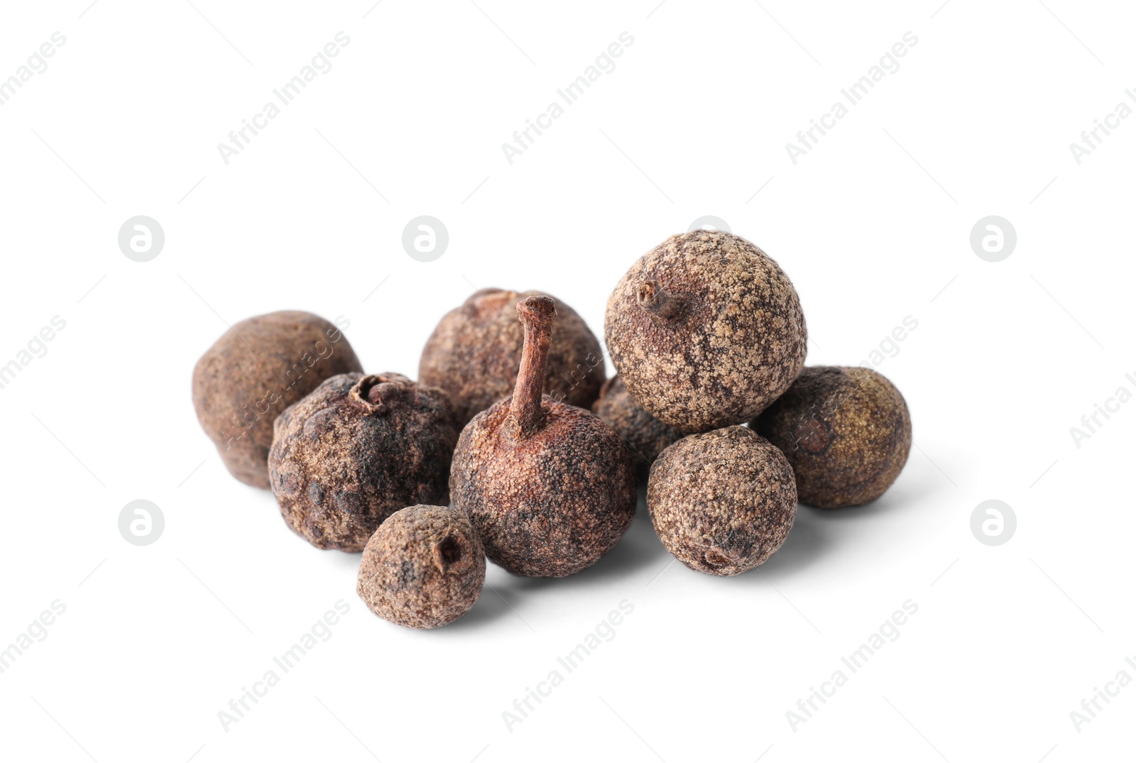 Photo of Spicy black pepper grains isolated on white