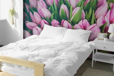Image of Cozy bedroom interior with comfortable furniture and beautiful floral wallpapers