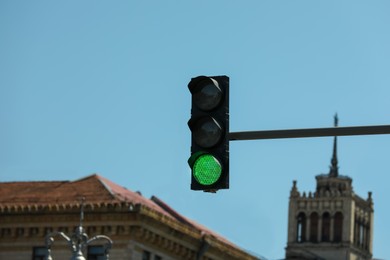 View of traffic light against blue sky