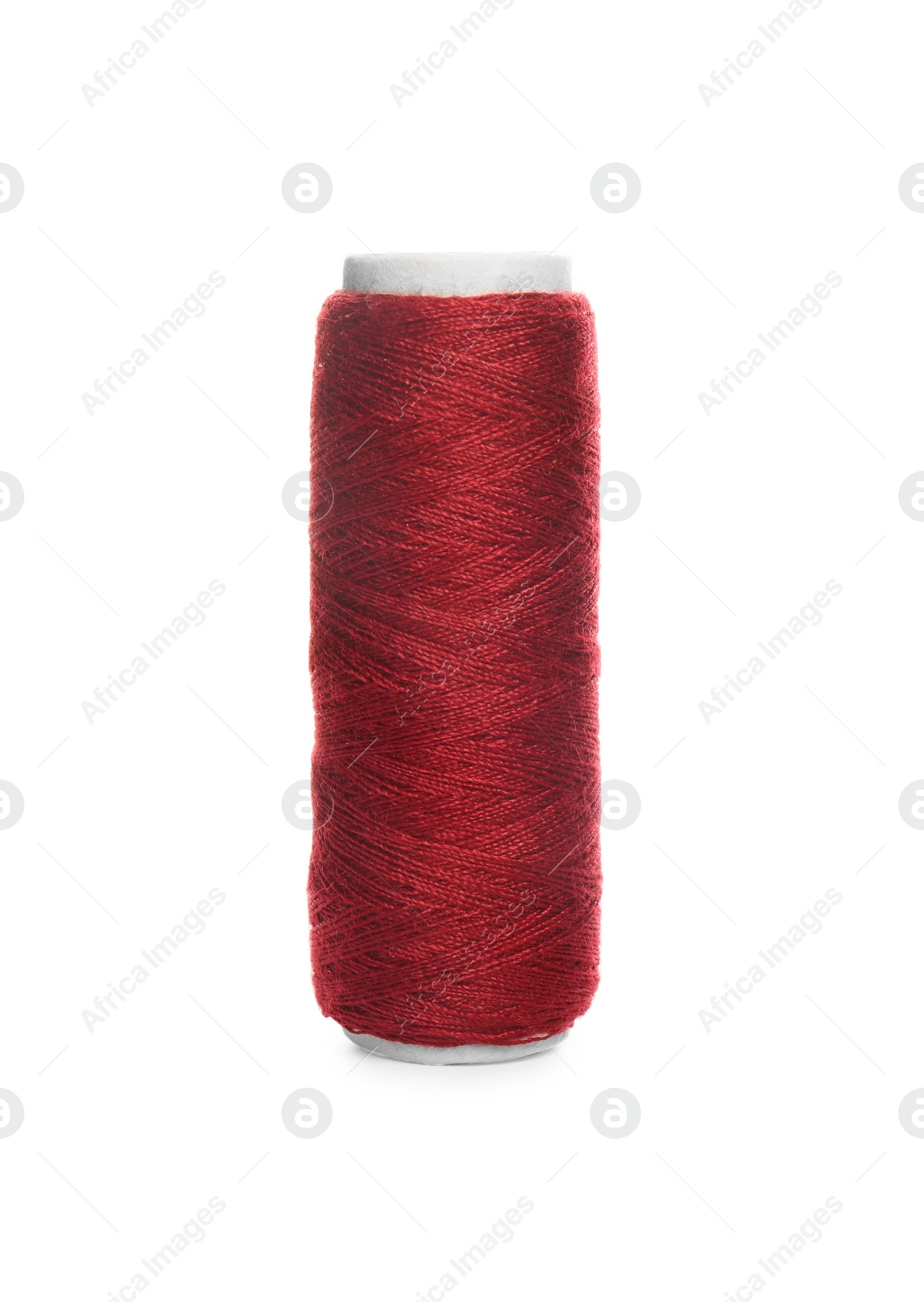 Photo of Spool of dark red sewing thread isolated on white