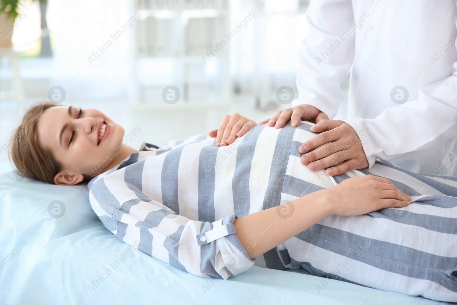 Photo of Gynecology consultation. Pregnant woman with her doctor in clinic