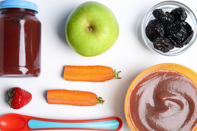 Flat lay composition with healthy baby food and ingredients on white background