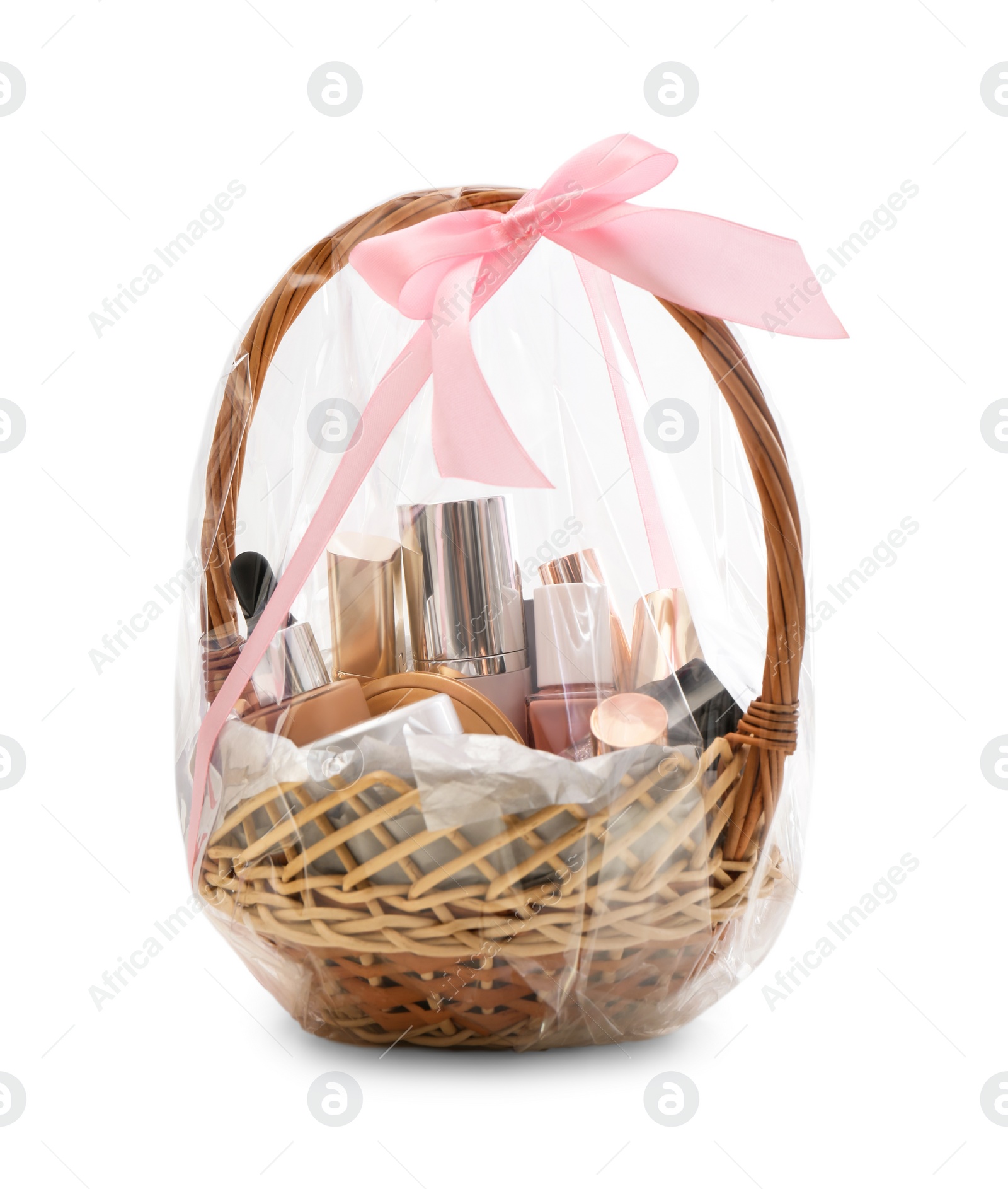 Photo of Wicker gift basket with cosmetic products isolated on white