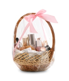 Wicker gift basket with cosmetic products isolated on white