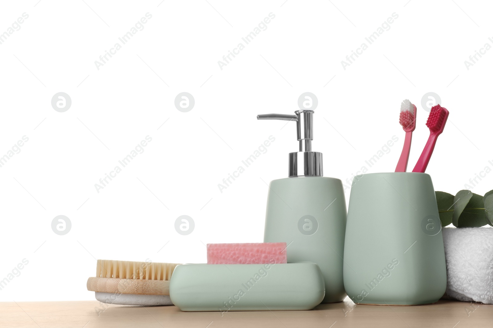 Photo of Bath accessories. Different personal care products on wooden table against white background. Space for text