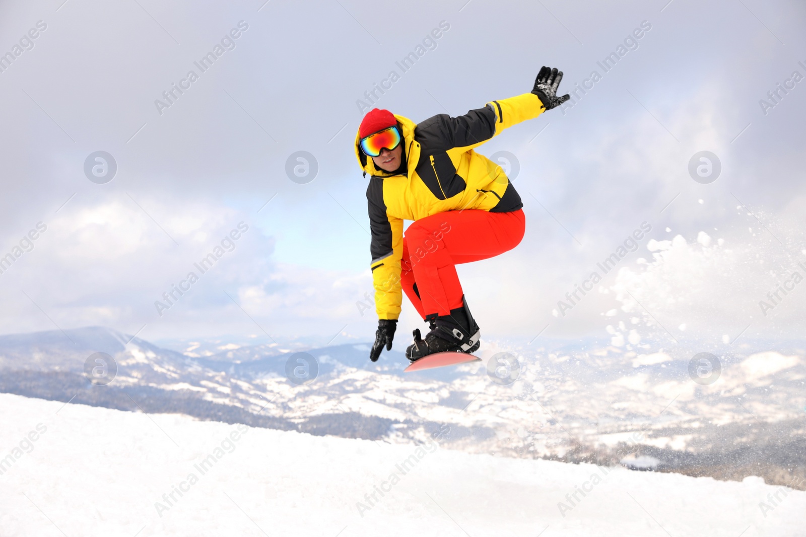 Photo of Male snowboarder on snowy hill. Winter vacation