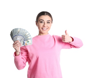 Portrait of young woman holding money banknotes on white background