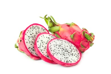 Photo of Delicious cut and whole pitahaya fruits on white background