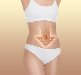 Healthy digestion. Woman with down arrow with different products on belly against beige background, closeup