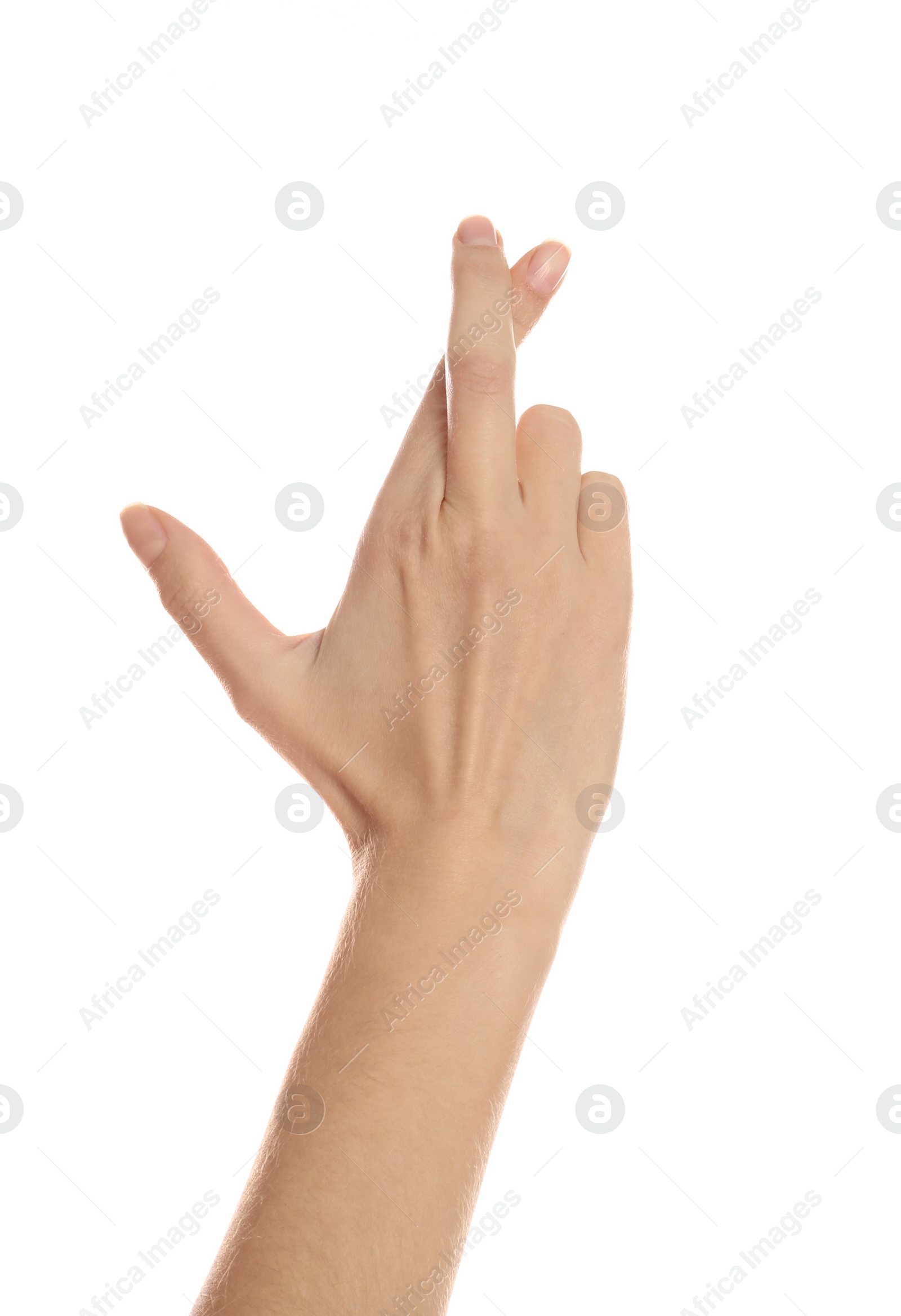 Photo of Woman with crossed fingers on white background, closeup. Superstition concept