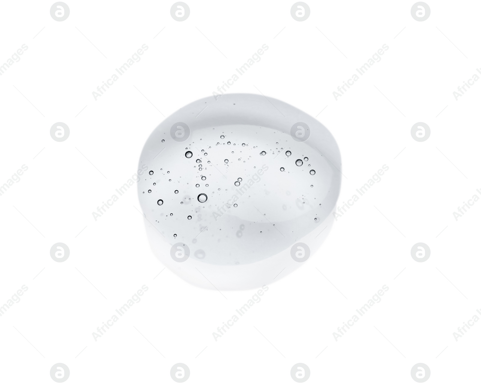 Photo of Drop of cosmetic oil on light surface, above view