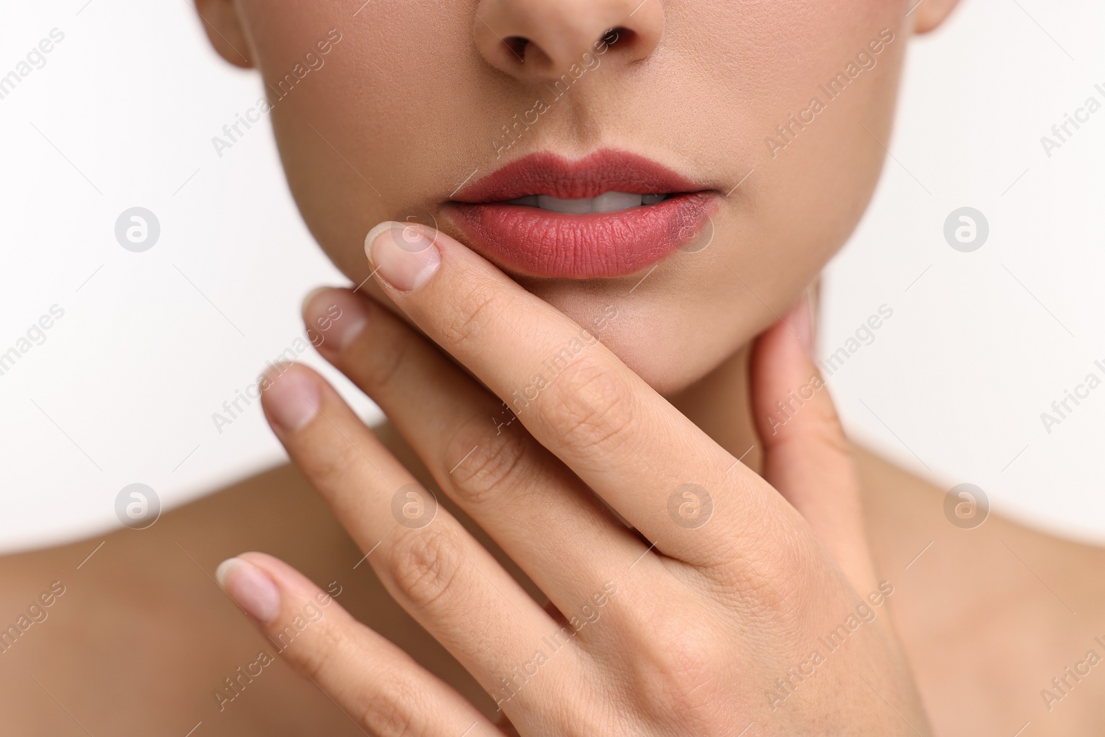 Photo of Woman with beautiful lips on white background, closeup